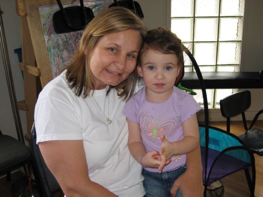 Kathy and Little Laura Saindon check out the action